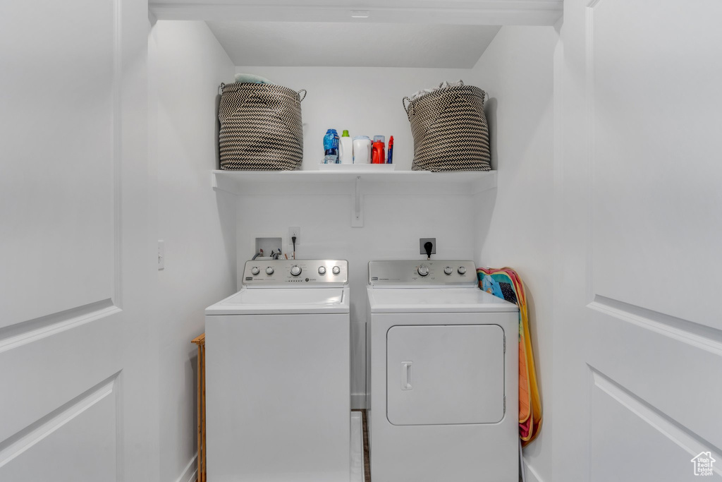 Laundry room with washing machine and dryer