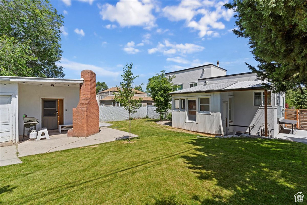 View of yard with a patio area
