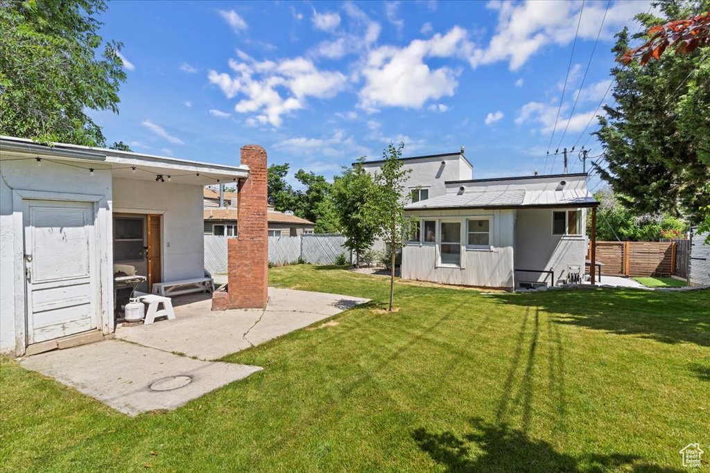 View of yard with a patio area and an outdoor structure