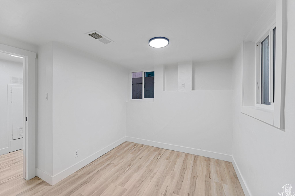 Spare room with light wood finished floors and baseboards
