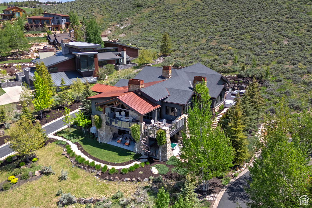 Aerial view of property and surrounding area with mountains