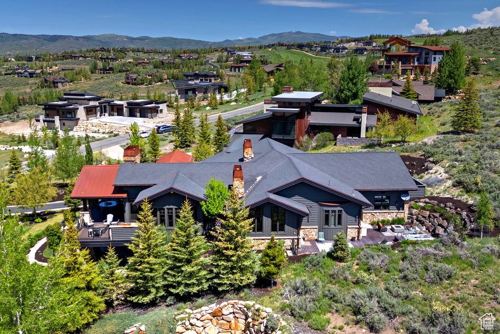 View of subject property featuring a mountain backdrop
