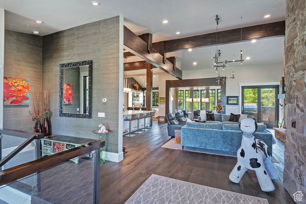 Living room with wood finished floors and recessed lighting