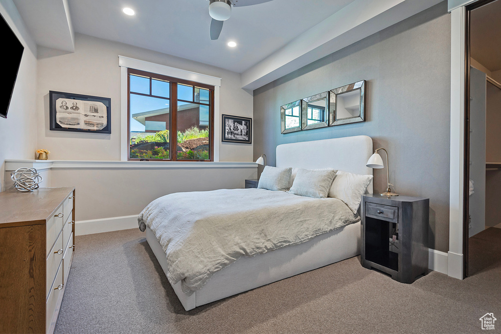 Carpeted bedroom featuring baseboards, recessed lighting, and ceiling fan