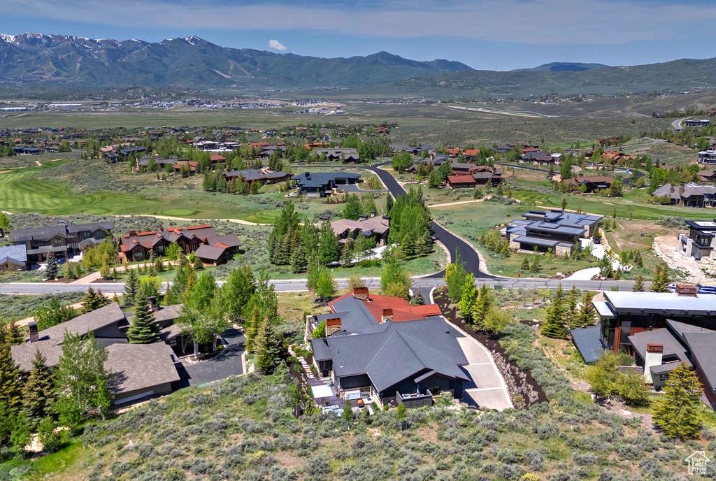 View of property location featuring nearby suburban area and mountains