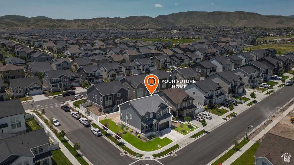 View of property location with a mountain backdrop and nearby suburban area