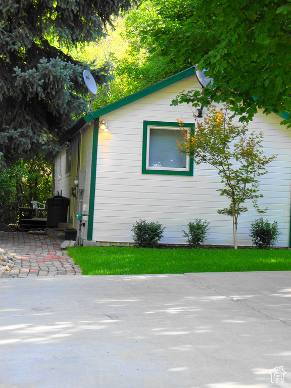 View of side of home featuring a patio