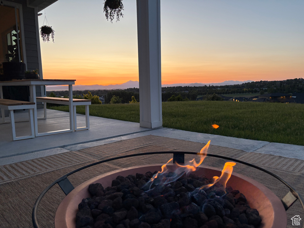 View of patio with an outdoor fire pit