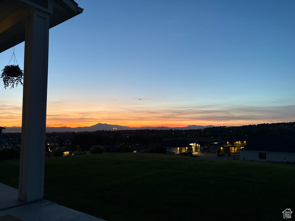 View of grassy yard featuring a mountain view