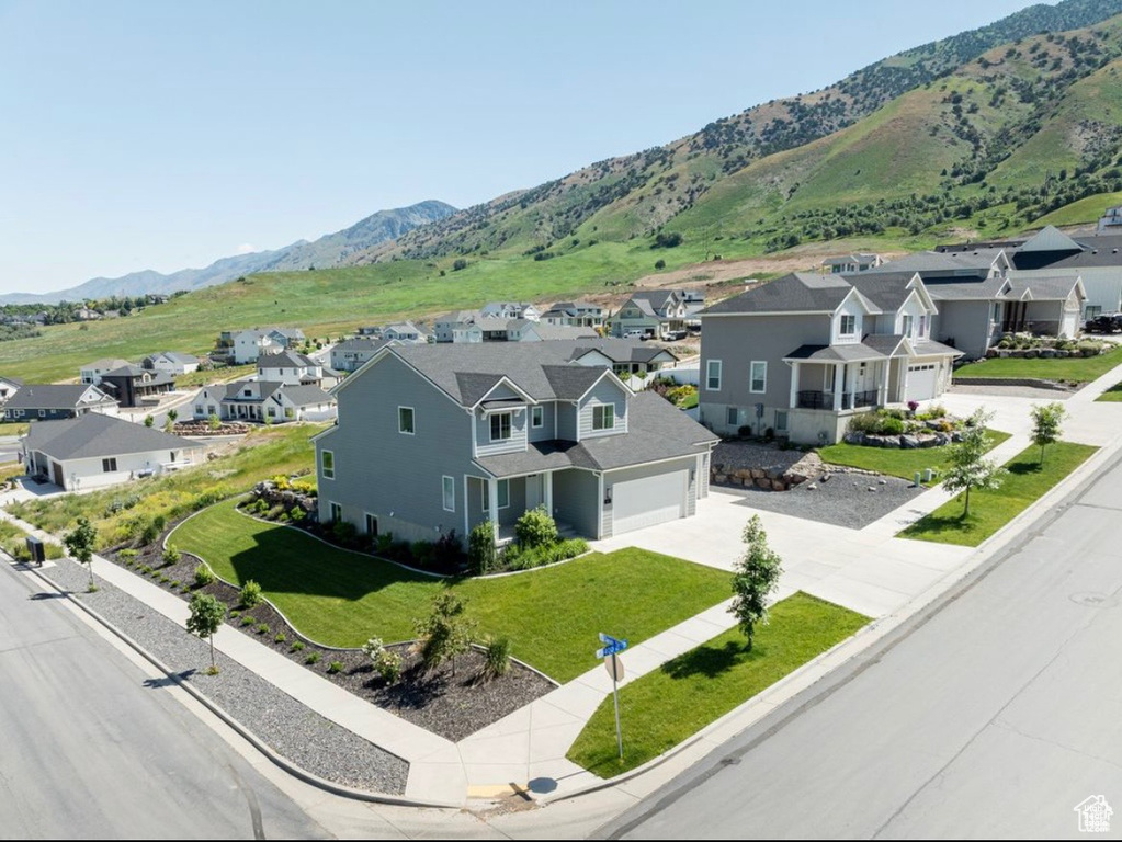 Aerial view of residential area featuring a mountain backdrop