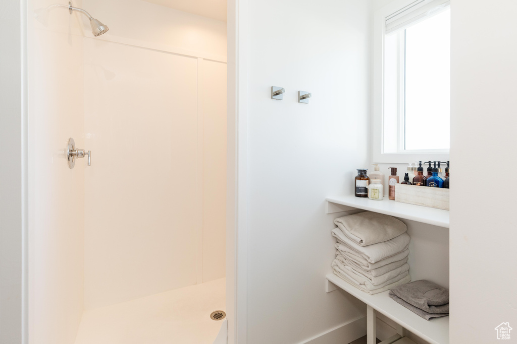 Full bathroom featuring a stall shower