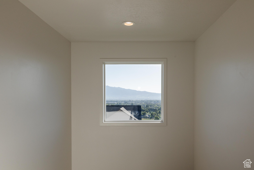 Spare room featuring recessed lighting and a mountain view