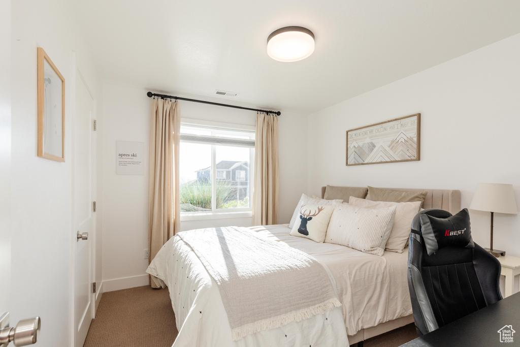 Bedroom featuring baseboards and carpet flooring