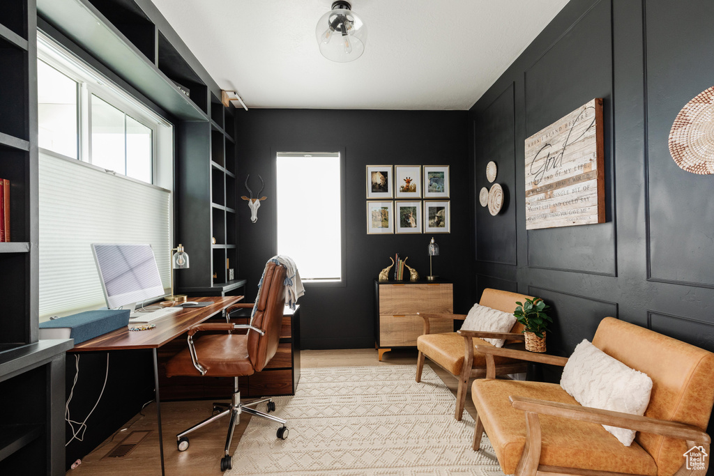 Office with light wood finished floors