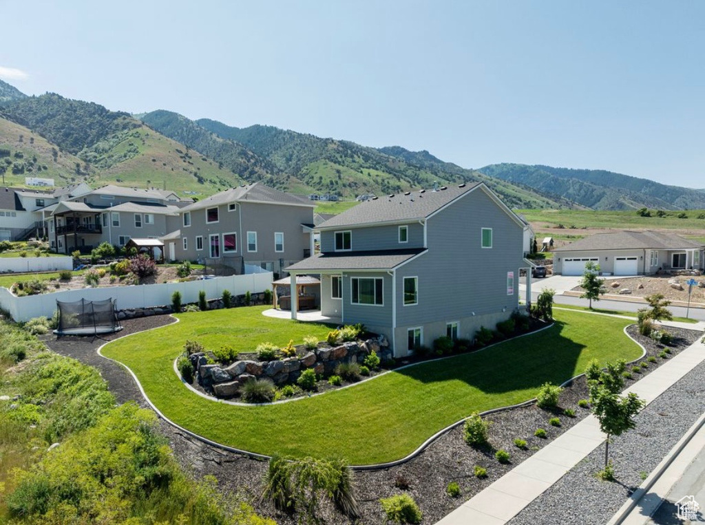 View of mountain background featuring nearby suburban area
