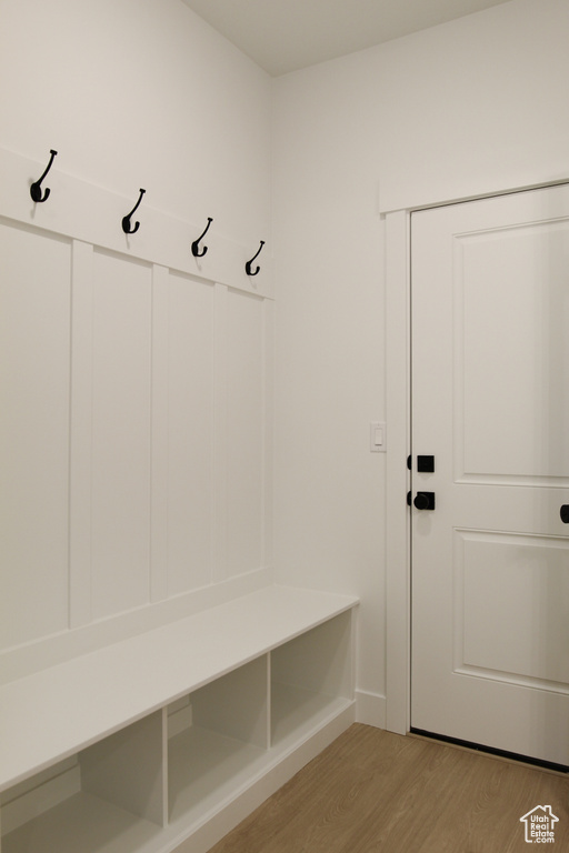 Mudroom with light wood-style floors