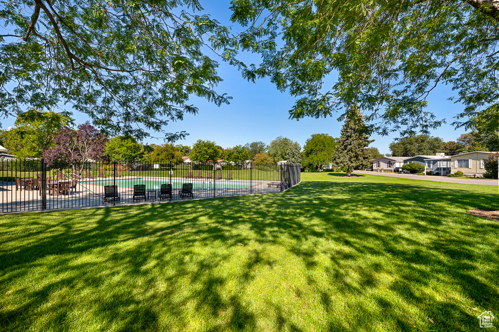 View of home\'s community featuring a pool