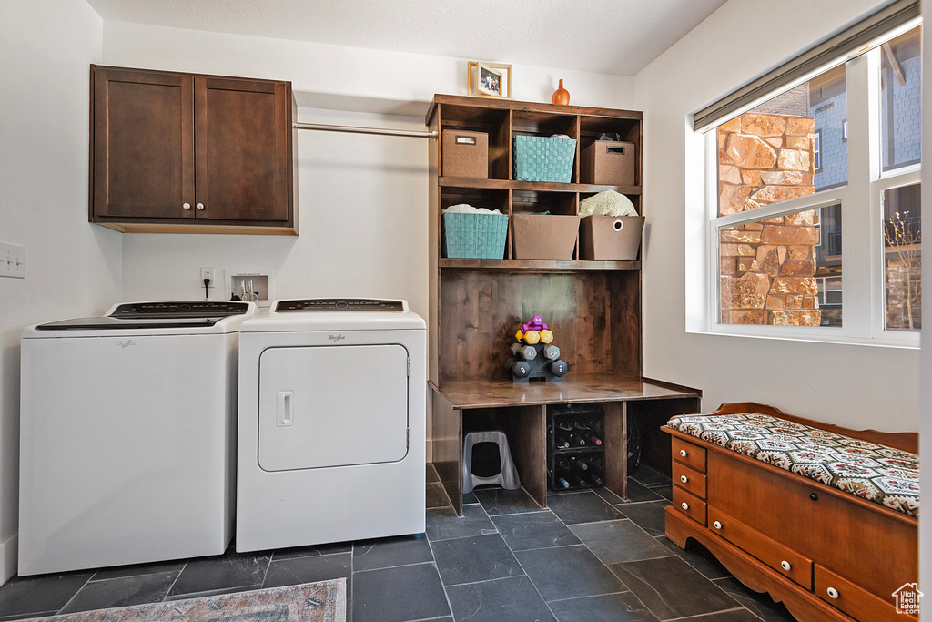 Laundry room with washer and dryer and cabinet space