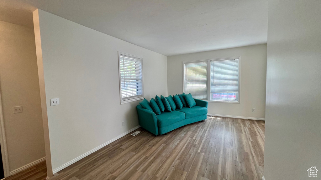 Living area featuring wood finished floors and baseboards