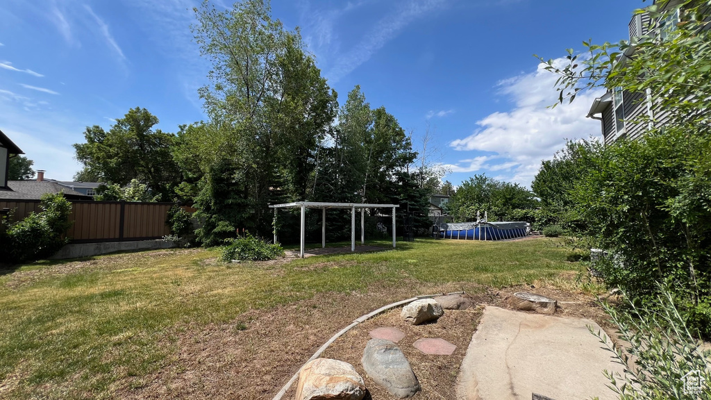 View of yard featuring a pergola