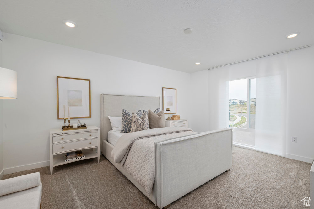 Bedroom featuring carpet, recessed lighting, and baseboards