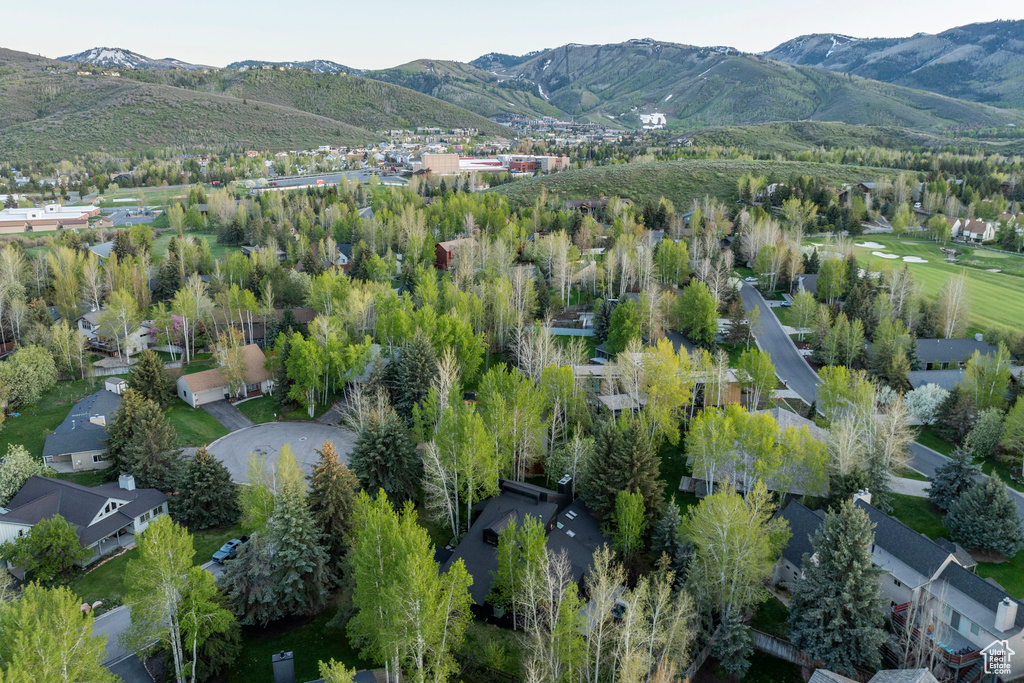 Aerial overview of property's location featuring a mountain backdrop