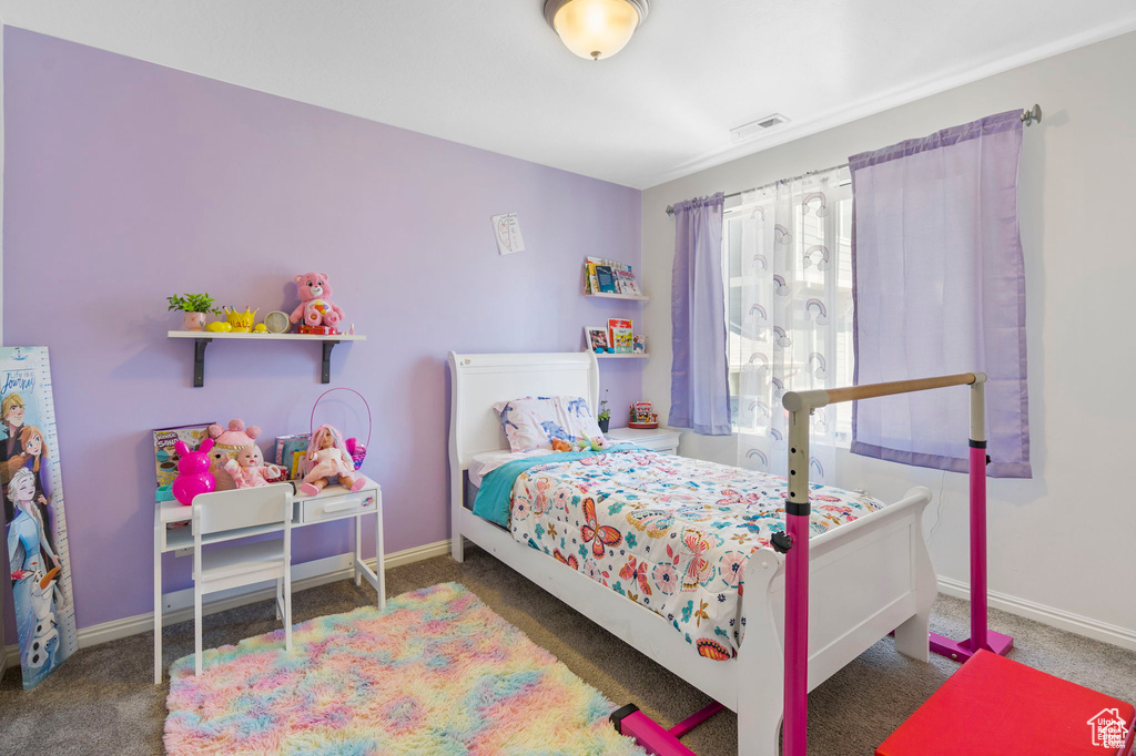 Carpeted bedroom with baseboards