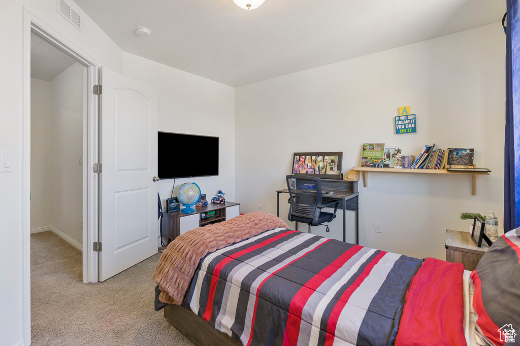 Bedroom featuring carpet floors