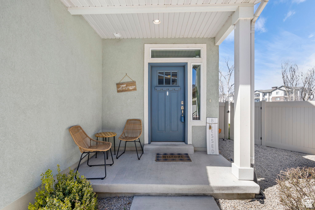 Doorway to property with stucco siding