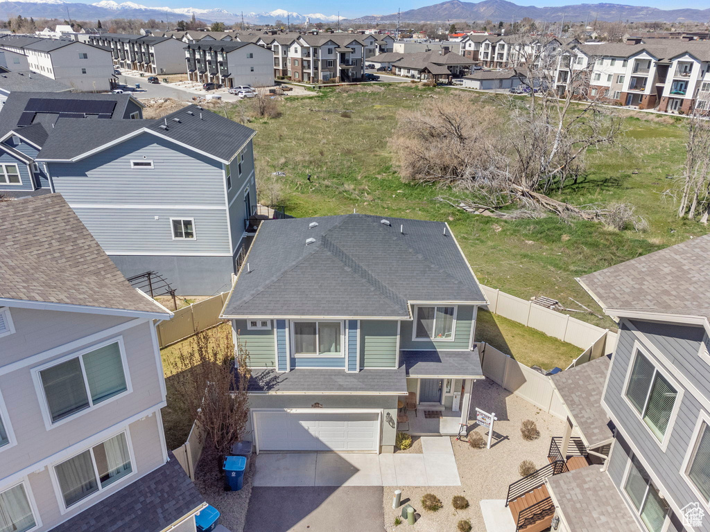 Aerial perspective of suburban area featuring a mountain backdrop