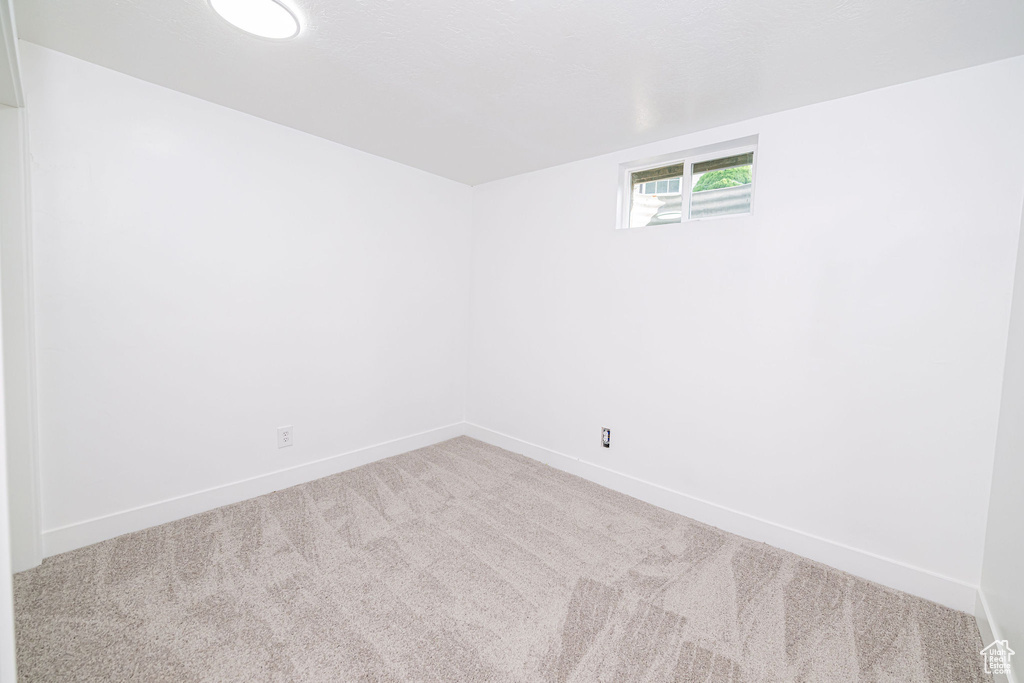 Spare room with carpet floors and baseboards