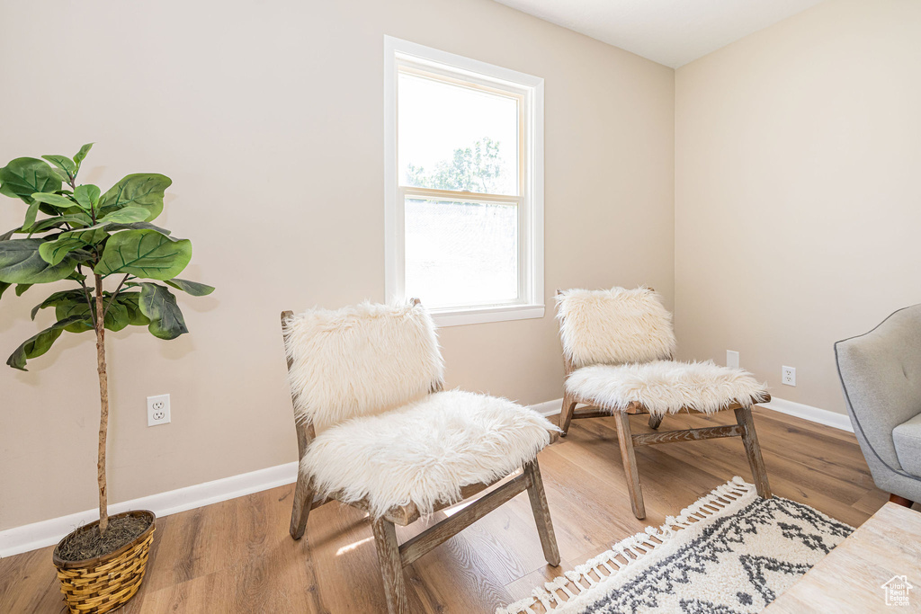 Sitting room with wood finished floors