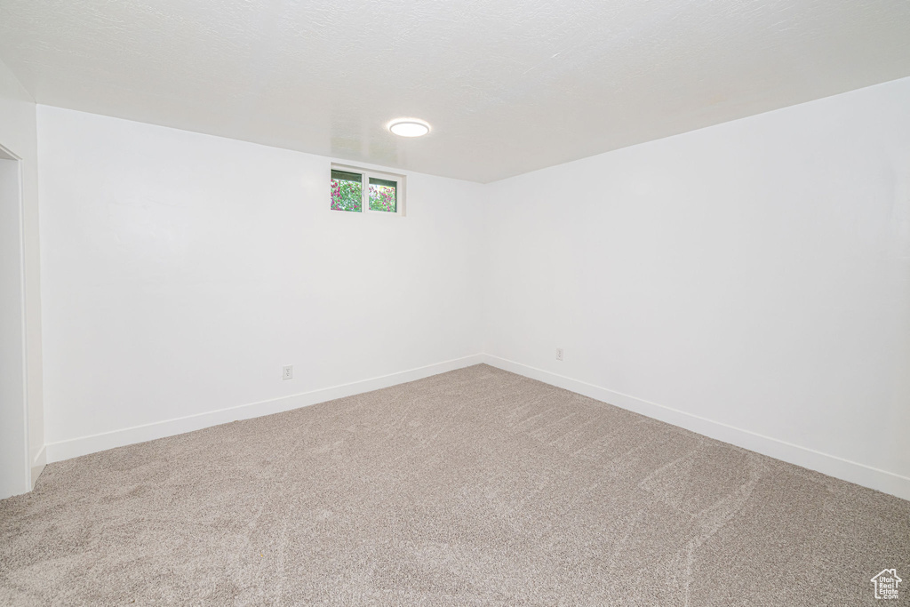 Spare room with carpet floors and baseboards