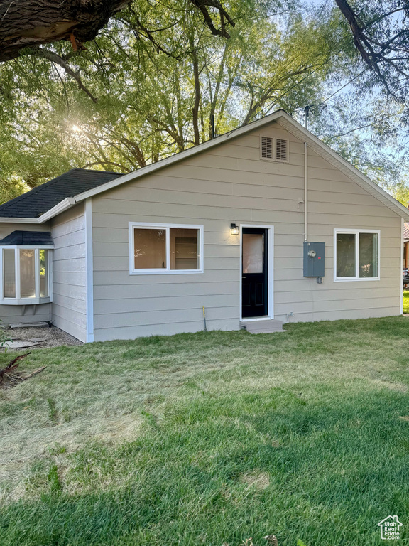 View of front of property with a front yard
