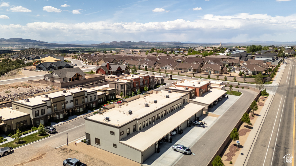 Aerial perspective of suburban area featuring a mountain backdrop