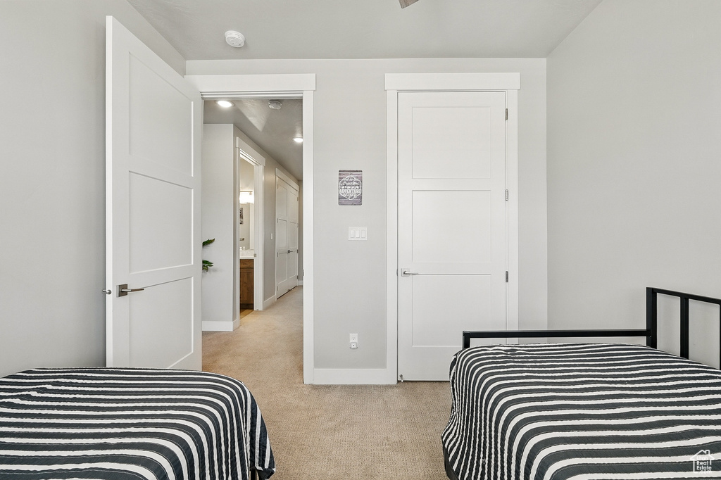 Carpeted bedroom with baseboards