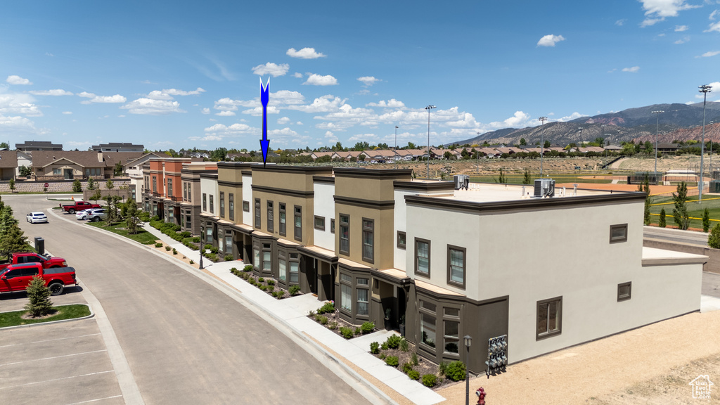 View of property featuring a mountain view and a residential view