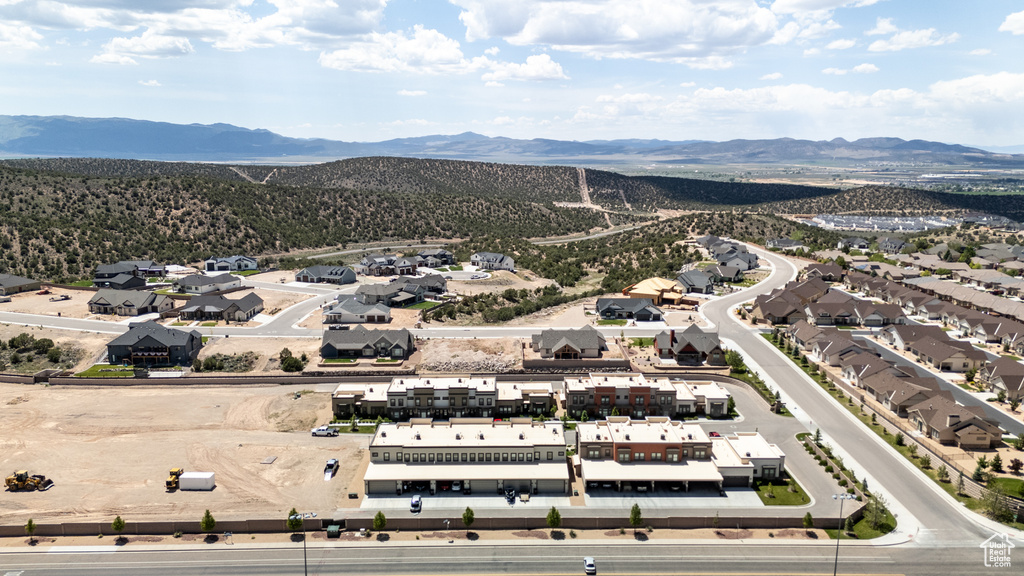 Aerial perspective of suburban area with a mountainous background