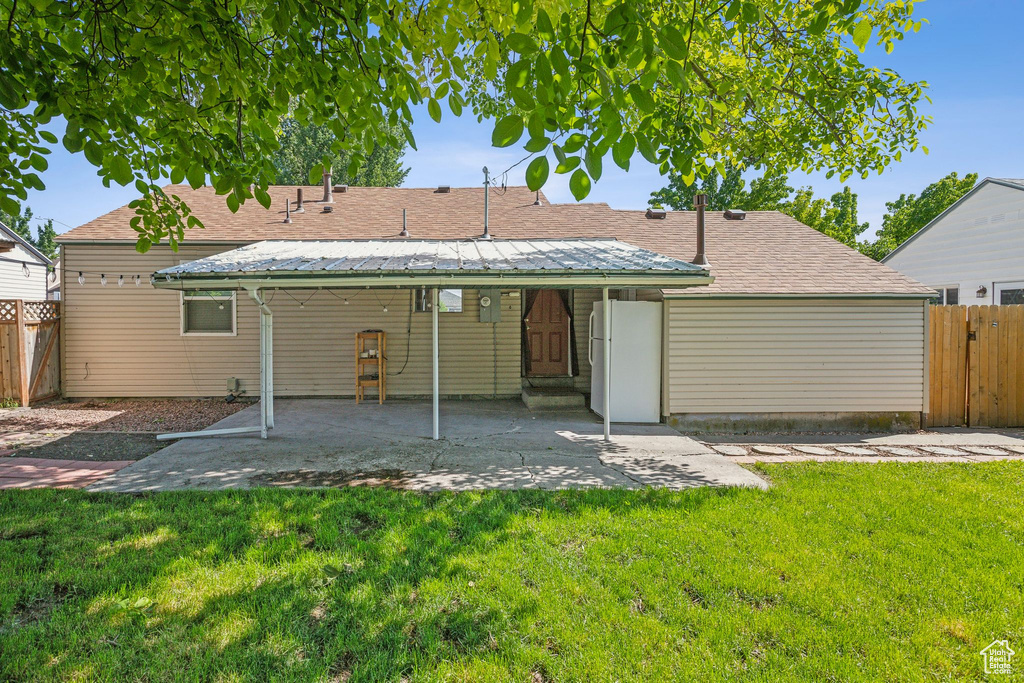 Back of house with a patio area