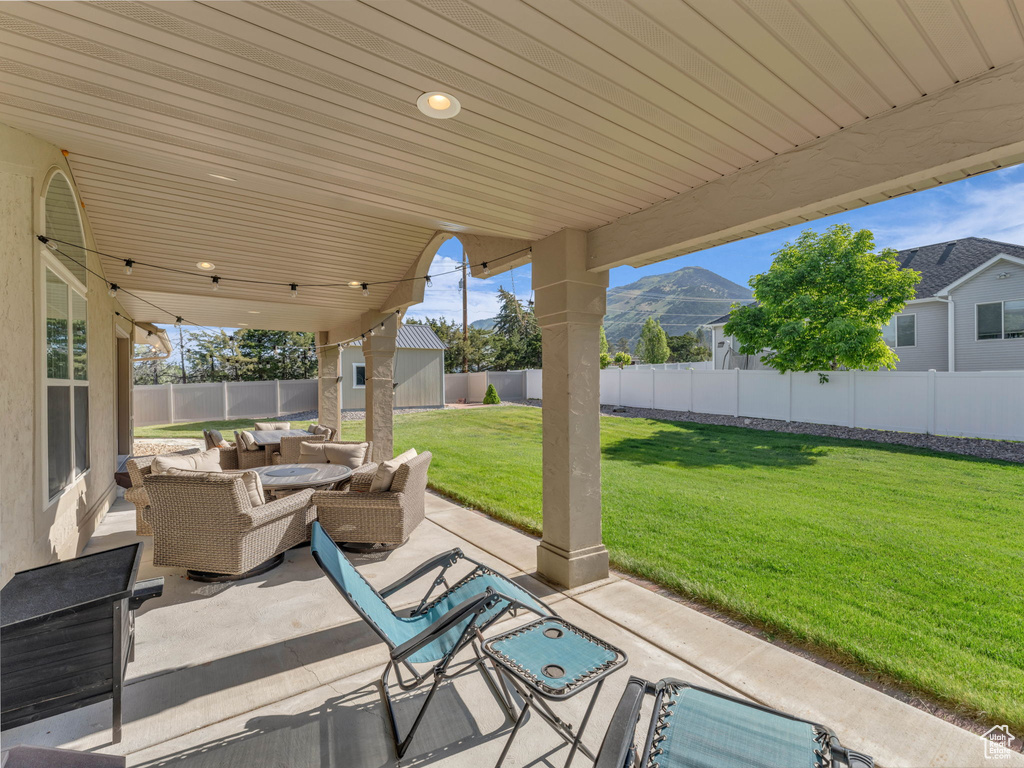 View of patio / terrace with an outdoor hangout area and a mountain view