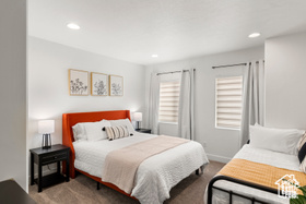 Carpeted bedroom featuring recessed lighting and baseboards