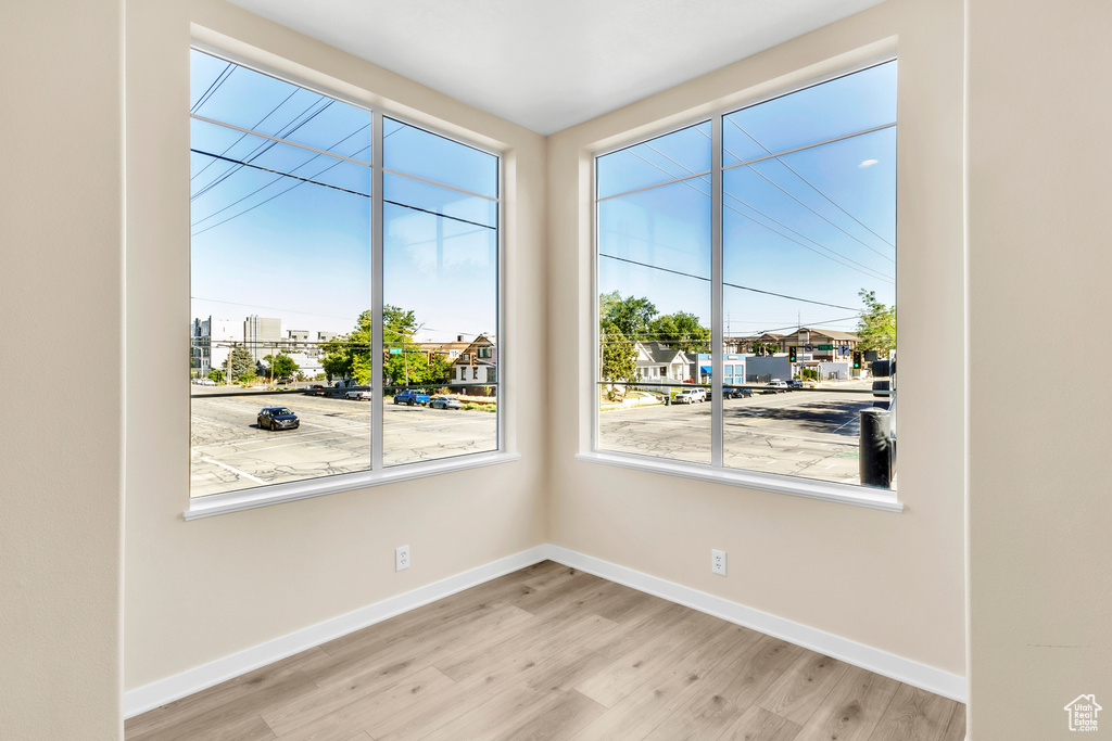 Spare room with light wood-style floors and baseboards