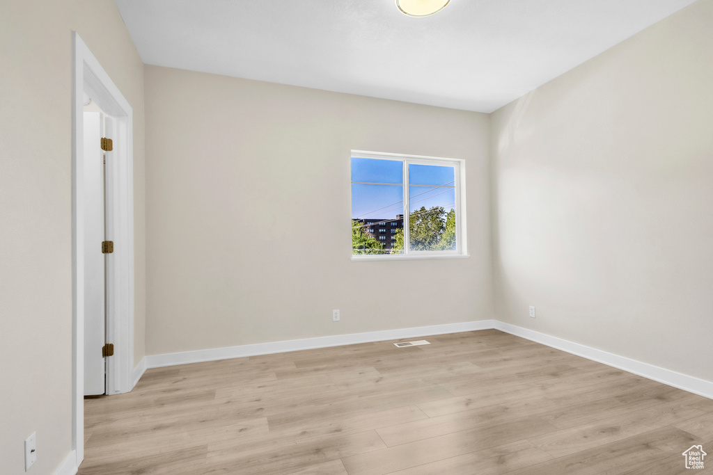 Empty room featuring light wood-style floors and baseboards