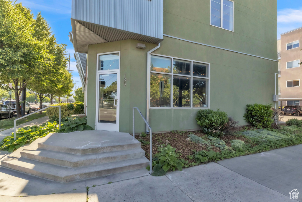 Entrance to property featuring stucco siding