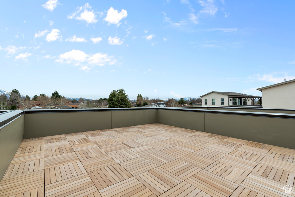 View of patio featuring a balcony