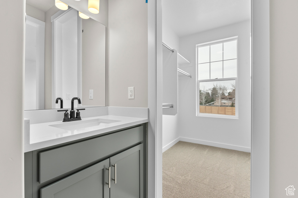 Bathroom with vanity and baseboards