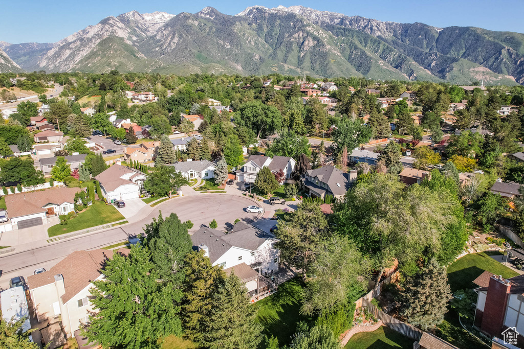 Aerial overview of property\\\'s location with nearby suburban area and a mountain backdrop