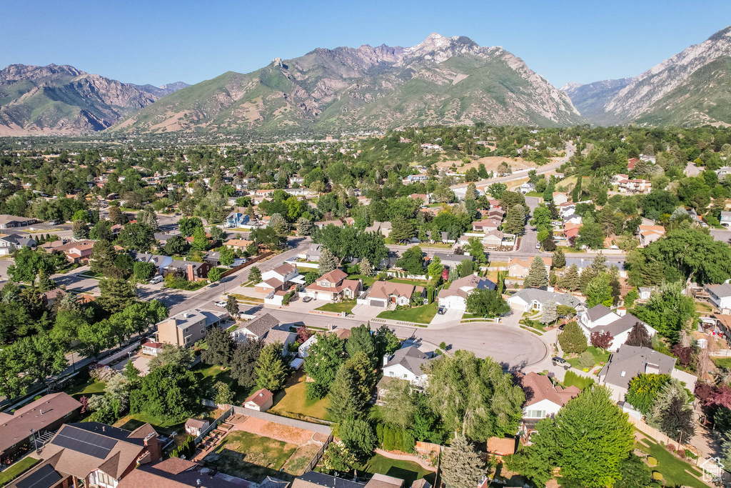 View of property location with mountains and nearby suburban area