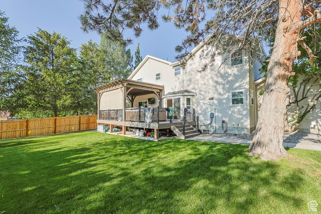 Rear view of house featuring a deck