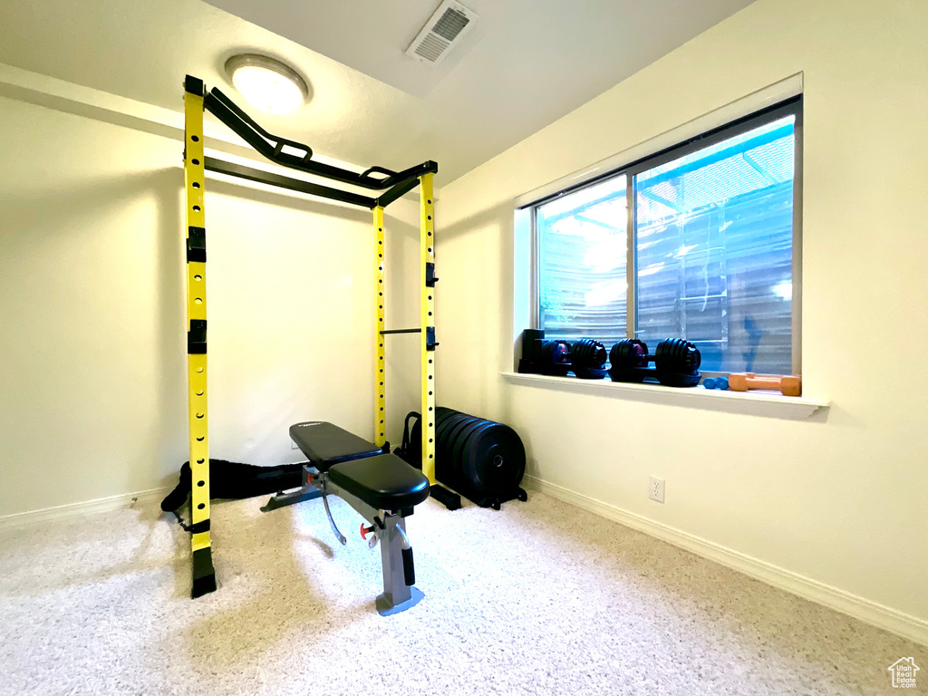 Workout area featuring baseboards